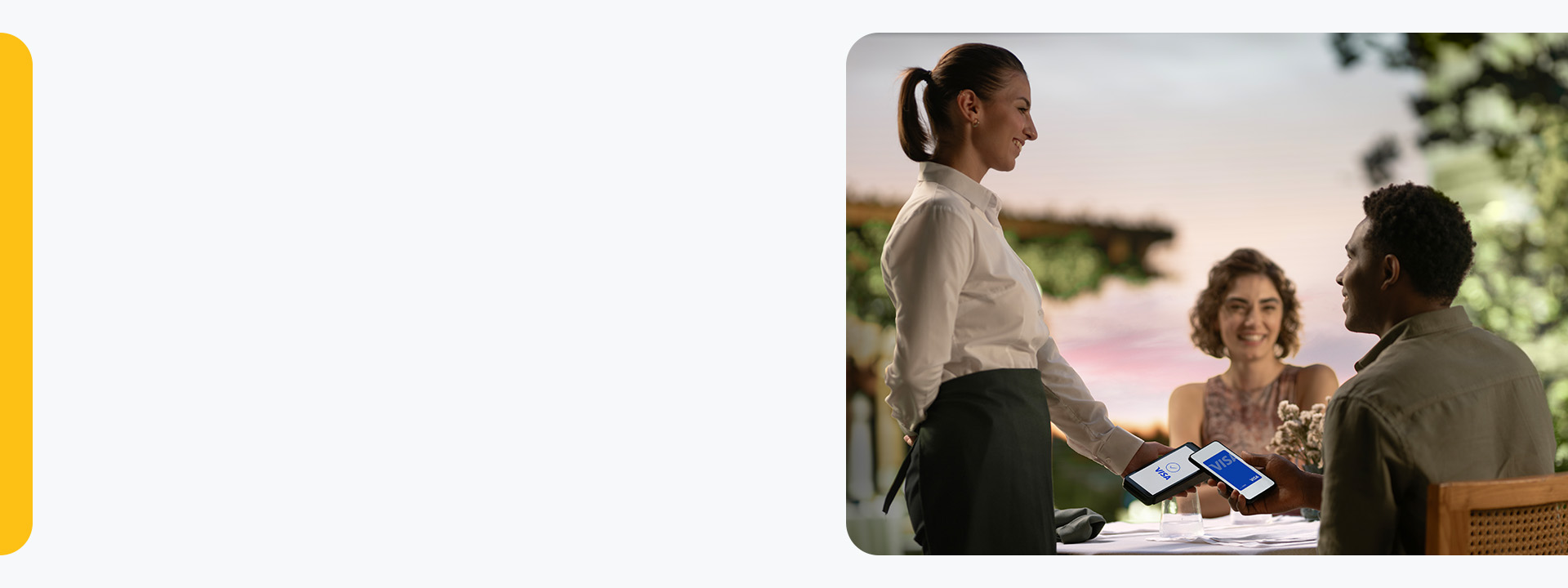 couple paying by phone at restaurant