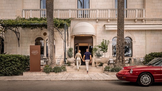 Couple walking into a hotel