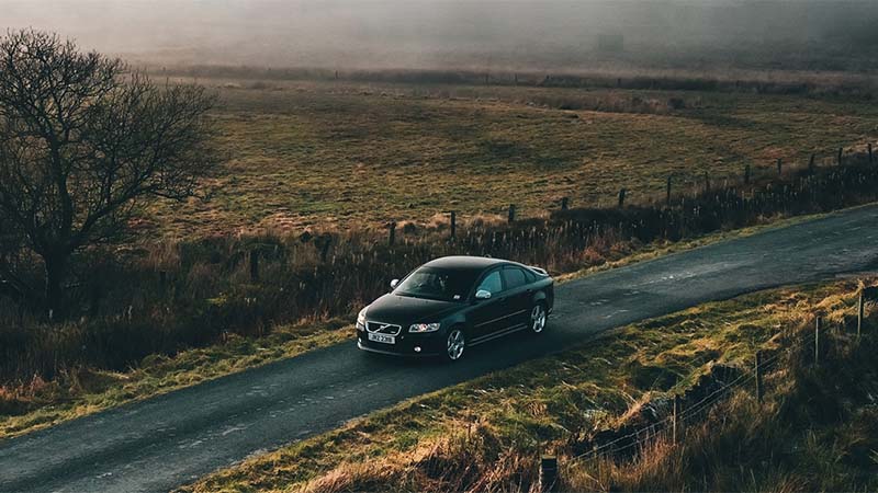 car driving down road